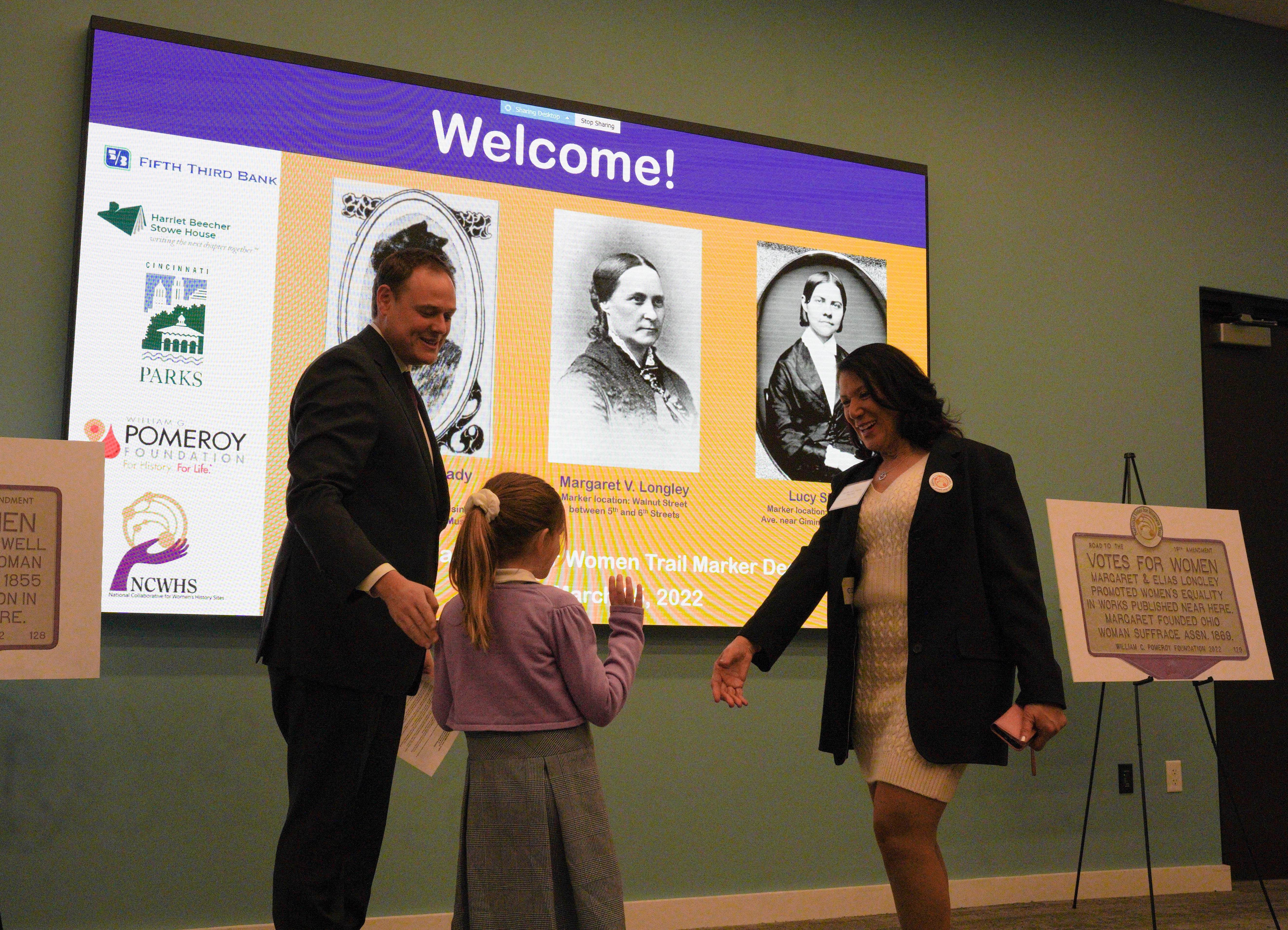 Vice Mayor shaking hands with girl